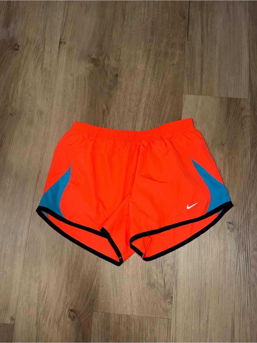 Nike Women's Neon Orange Running Shorts with Teal Panels